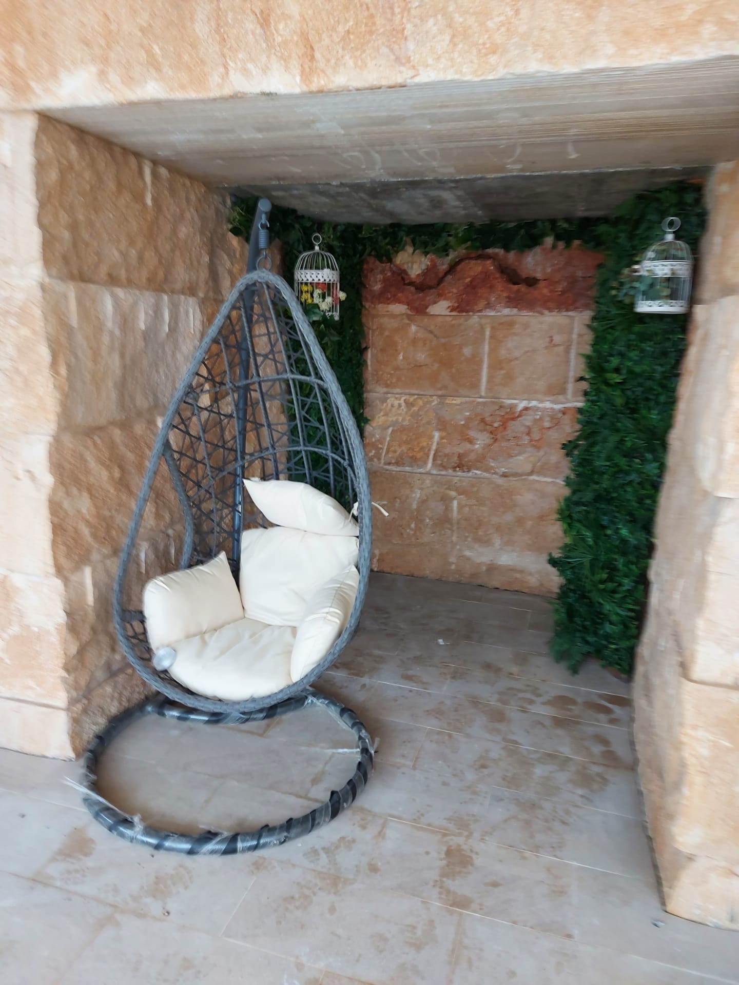 Stone alcove with hanging chair