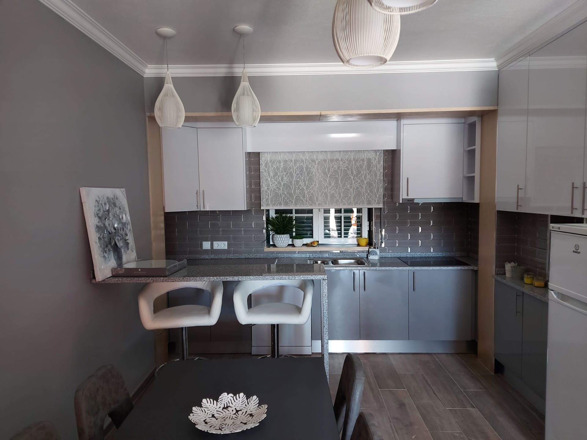 Two-bedroom apartment kitchen with breakfast bar and dining